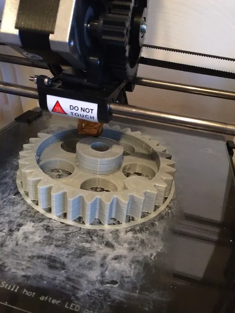 A 3D printer printing a large gear